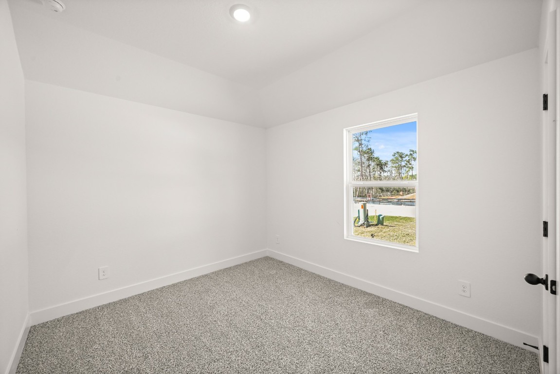 15775 Hanson Ridge Drive Montgomery, TX 77316 - Photo 20 of 33 an empty room with windows