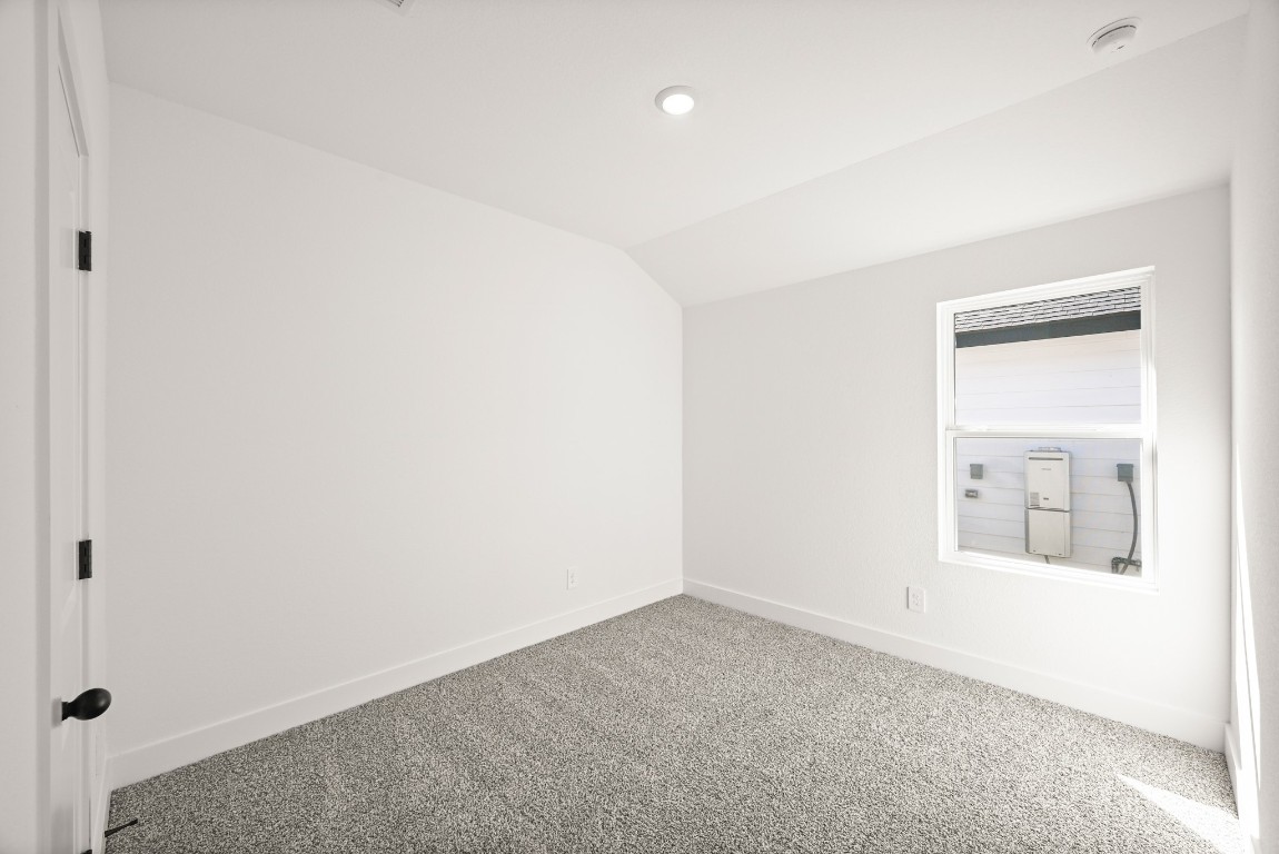 15775 Hanson Ridge Drive Montgomery, TX 77316 - Photo 23 of 33 an empty room with windows and closet