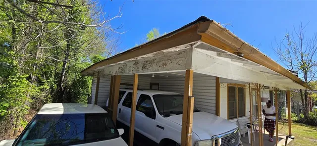 a view of deck with table and chairs and wooden floor