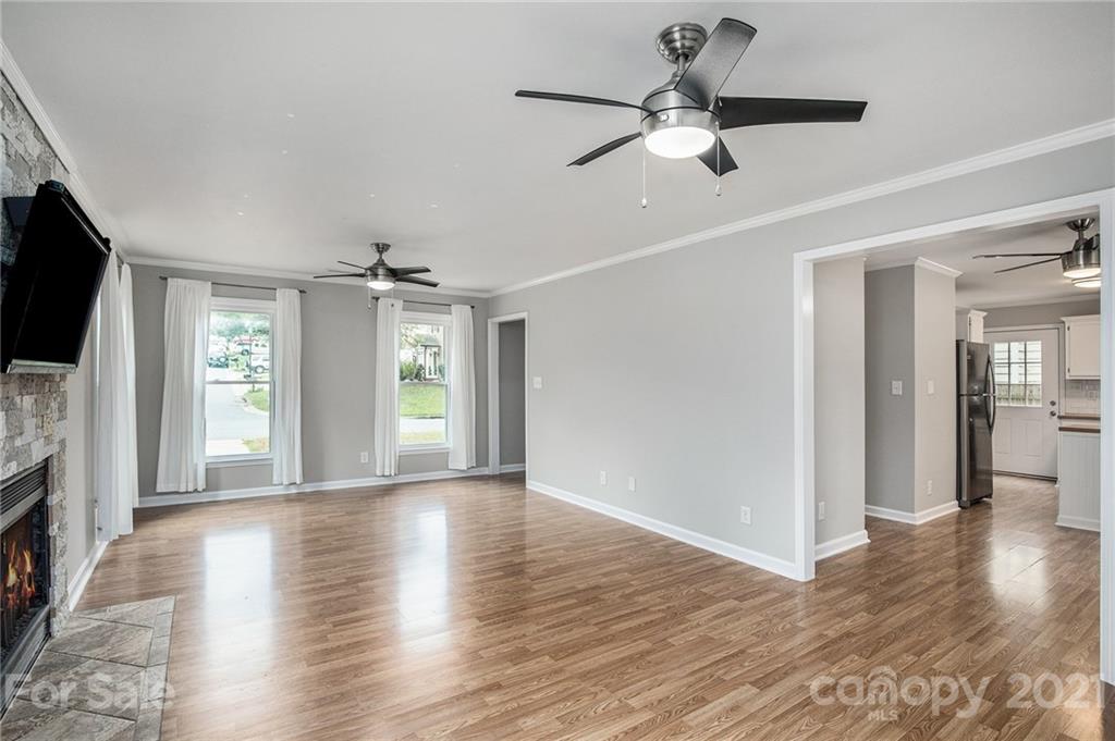 3517 Rosedown Drive Matthews, NC 28105 - Photo 16 of 28 a view of an empty room with window and wooden floor