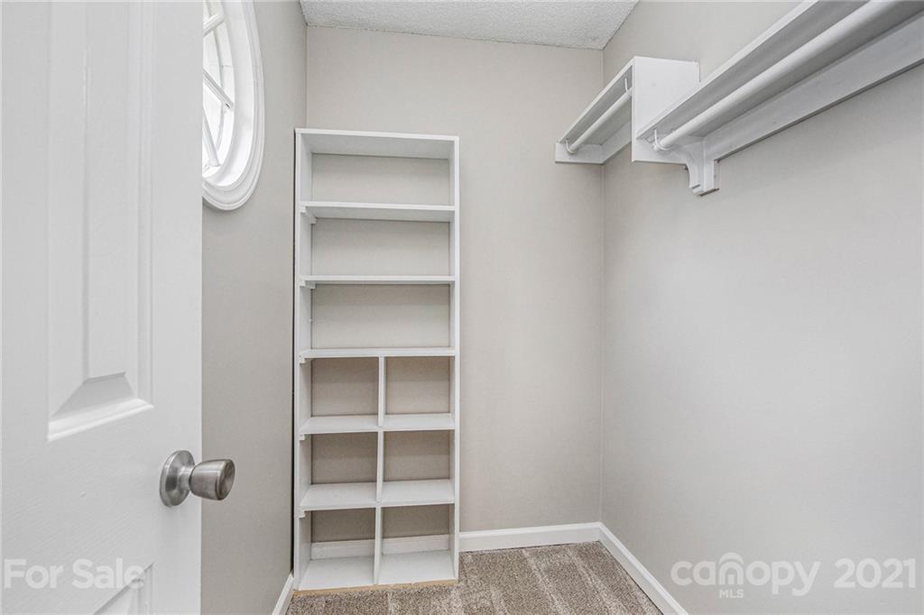 3517 Rosedown Drive Matthews, NC 28105 - Photo 22 of 28 a view of walk in closet with empty racks