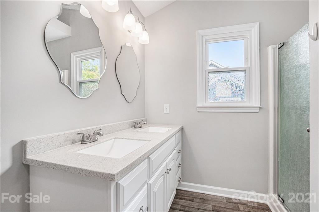 3517 Rosedown Drive Matthews, NC 28105 - Photo 24 of 28 a bathroom with a sink and a mirror