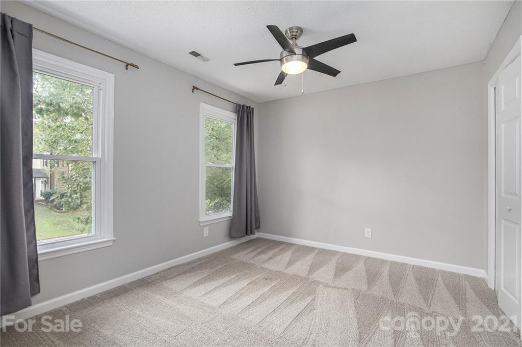 3517 Rosedown Drive Matthews, NC 28105 - Photo 27 of 28 a view of a big room with wooden floor and windows