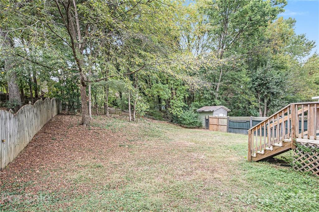 3517 Rosedown Drive Matthews, NC 28105 - Photo 7 of 28 a view of backyard with green space