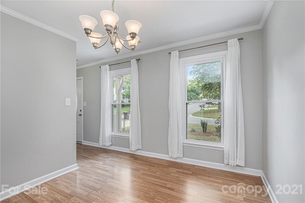 3517 Rosedown Drive Matthews, NC 28105 - Photo 8 of 28 a view of a room with wooden floor and chandelier