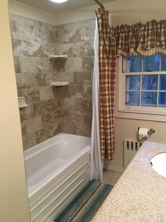 3333 Diamond Hill Road Cumberland, RI 02864 - Photo 18 of 29 a bathroom with a bathtub and shower