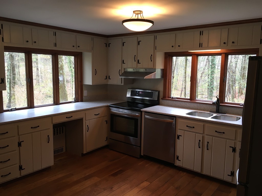 3333 Diamond Hill Road Cumberland, RI 02864 - Photo 24 of 29 a kitchen with a sink stove and cabinets