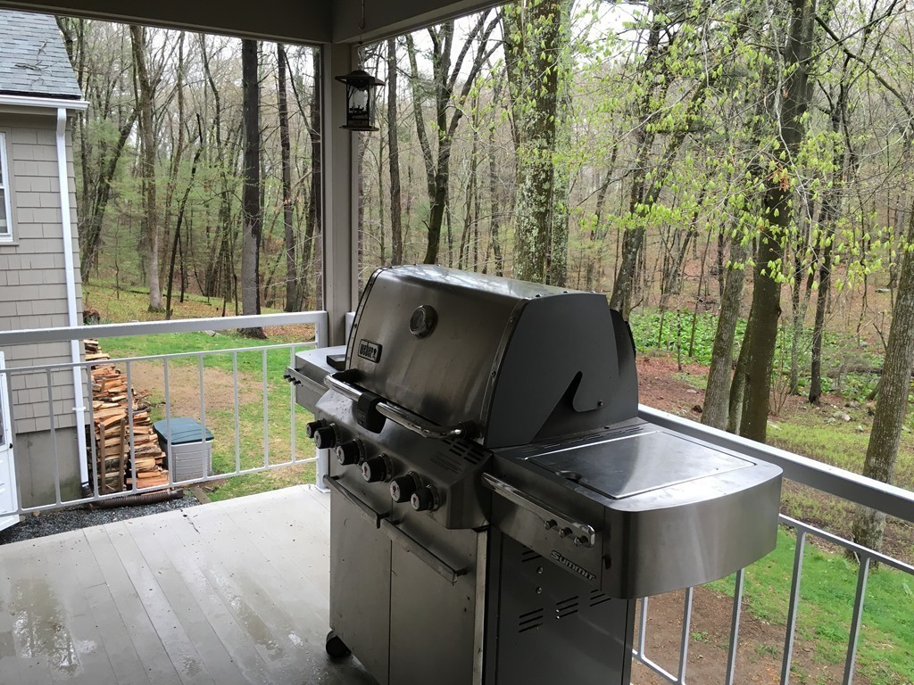 3333 Diamond Hill Road Cumberland, RI 02864 - Photo 25 of 29 a backyard of a house with table and chairs