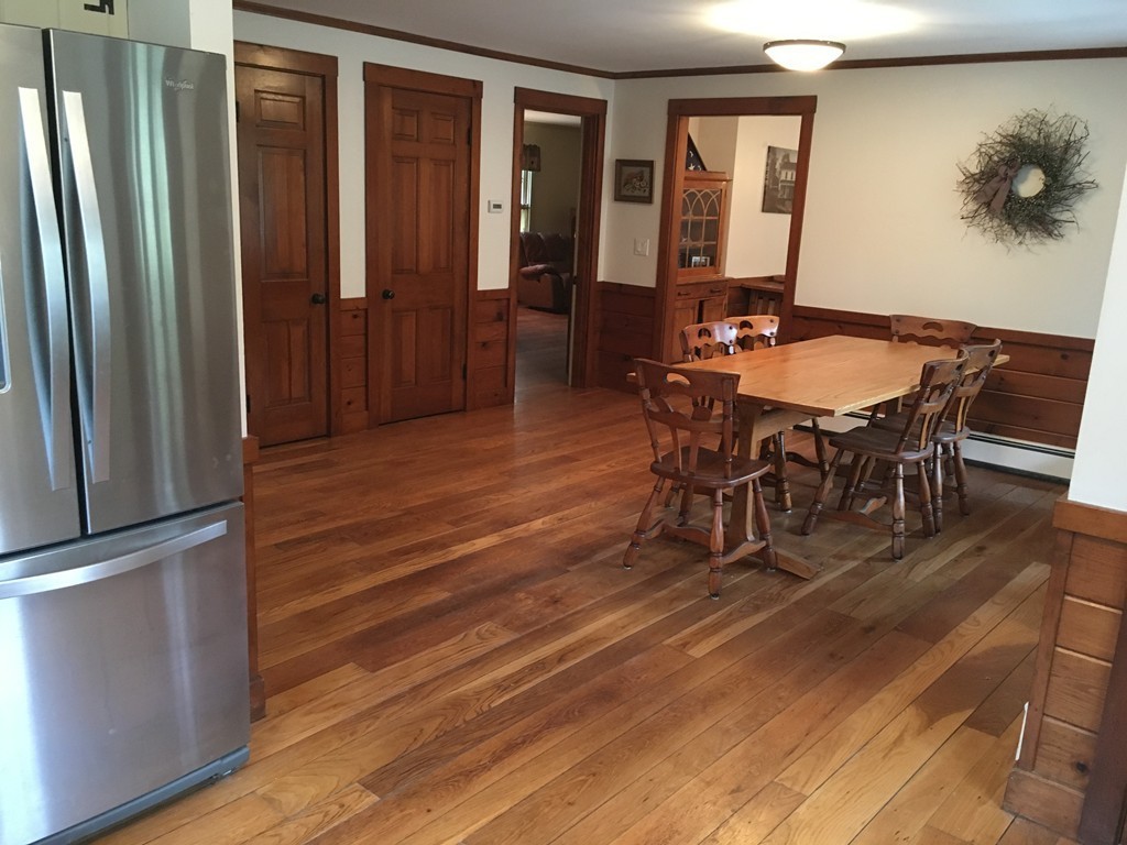 3333 Diamond Hill Road Cumberland, RI 02864 - Photo 8 of 29 a dining room with furniture entryway and wooden floor