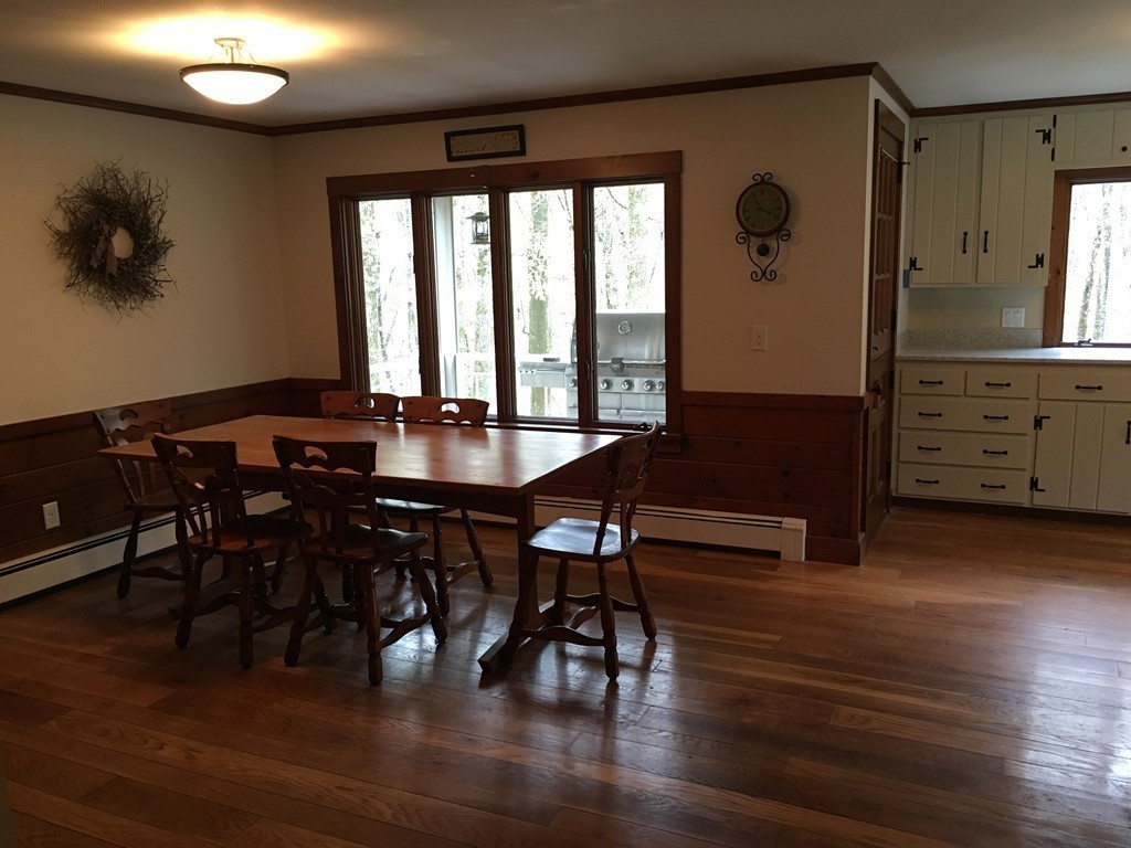 3333 Diamond Hill Road Cumberland, RI 02864 - Photo 9 of 29 a view of a dining room with furniture window and wooden floor