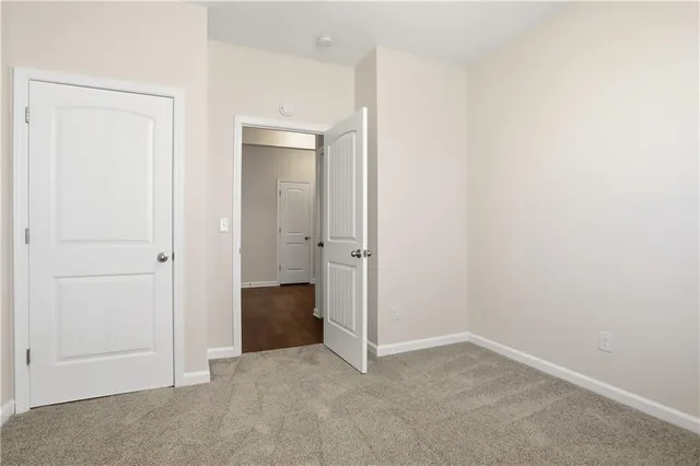 an empty room with closet area