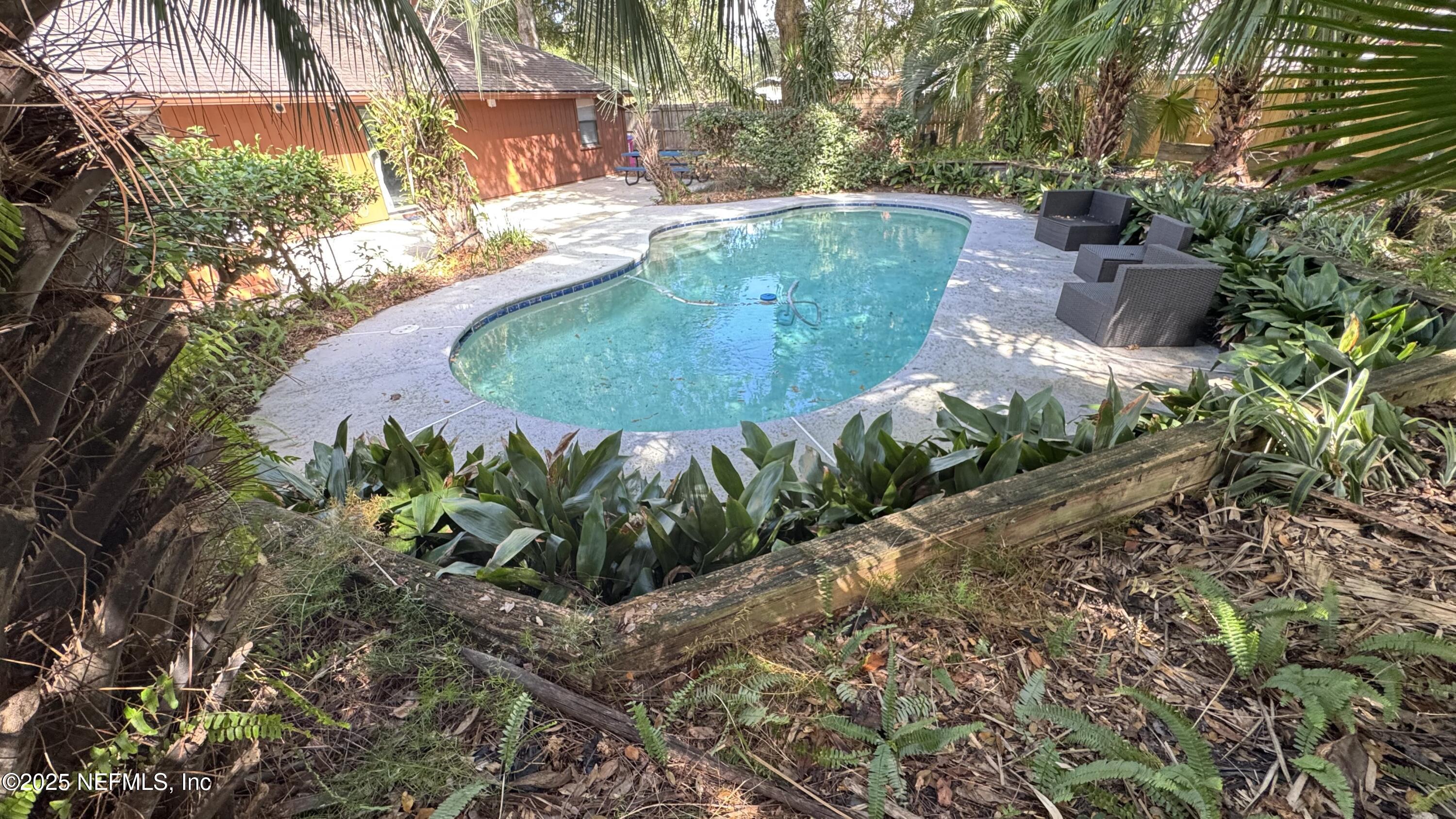 11238 McCormick Road Jacksonville, FL 32225 - Photo 22 of 25 a view of a garden with a fountain