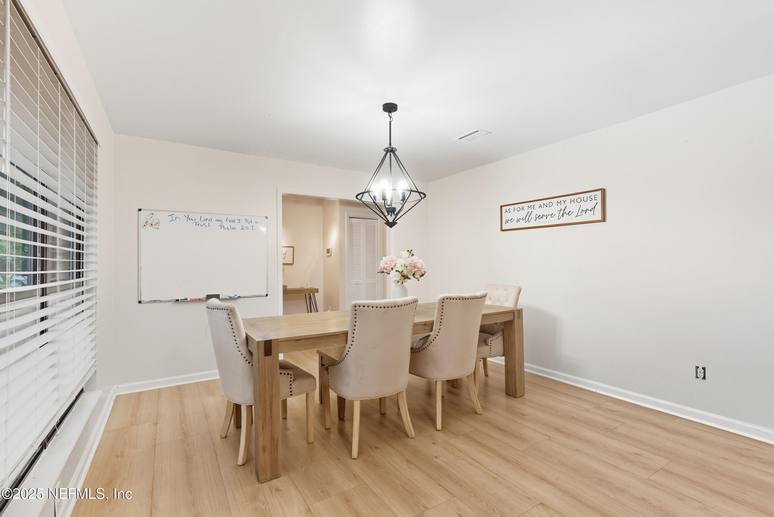 11238 McCormick Road Jacksonville, FL 32225 - Photo 6 of 25 a view of a dining room with furniture window and wooden floor