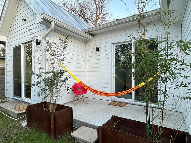View of side of home with a metal roof