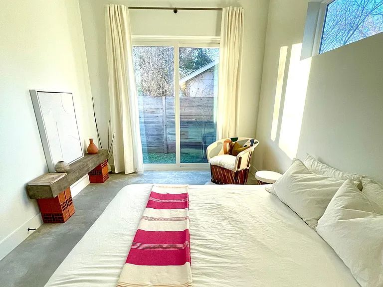 910 Gullett Street, Unit 2 Austin, TX 78702 - Photo 11 of 19 Bedroom featuring concrete flooring and baseboards