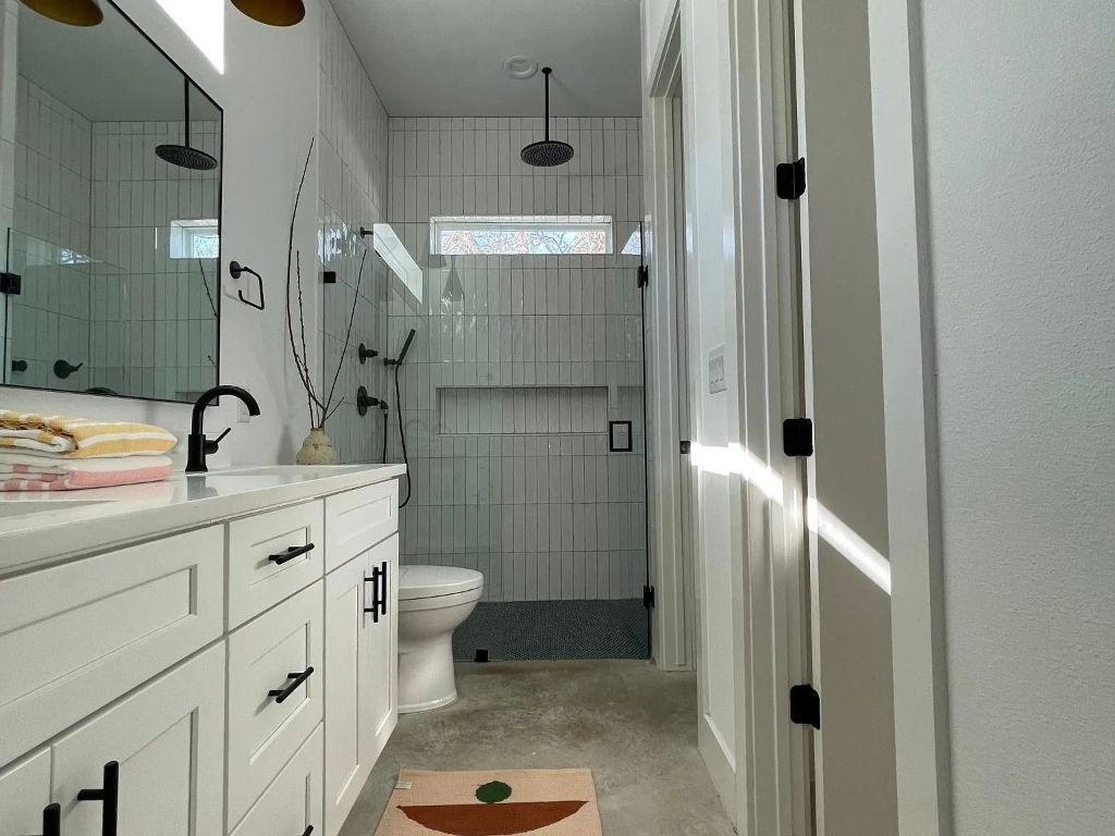 910 Gullett Street, Unit 2 Austin, TX 78702 - Photo 13 of 19 Bathroom featuring vanity, a shower stall, and unfinished concrete floors
