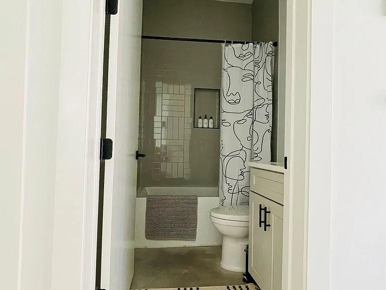 910 Gullett Street, Unit 2 Austin, TX 78702 - Photo 18 of 19 Full bathroom featuring vanity and shower / tub combo with curtain