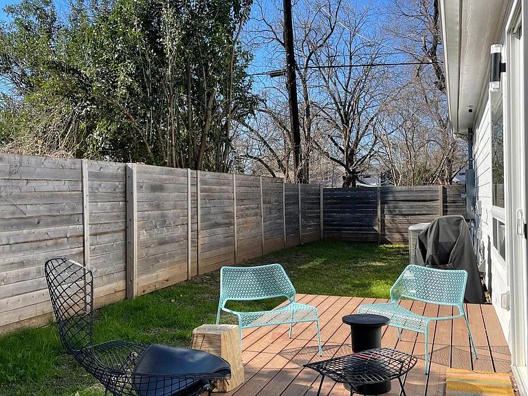 910 Gullett Street, Unit 2 Austin, TX 78702 - Photo 2 of 19 Wooden deck featuring a fenced backyard and a grill