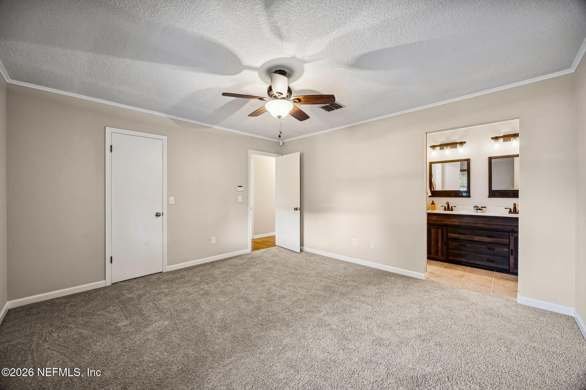 1888 Clemson Road Jacksonville, FL 32217 - Photo 14 of 41 a view of an empty room with a kitchen