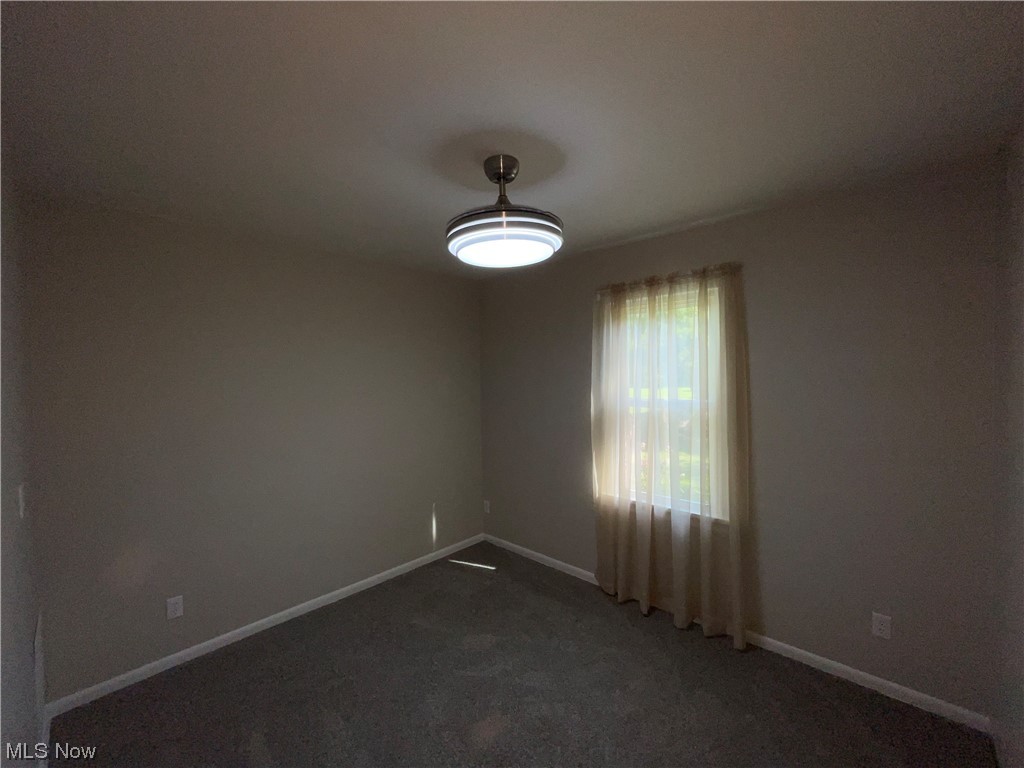 7114 Risden Road Vermilion, OH 44089 - Photo 21 of 35 Empty room with dark carpet
