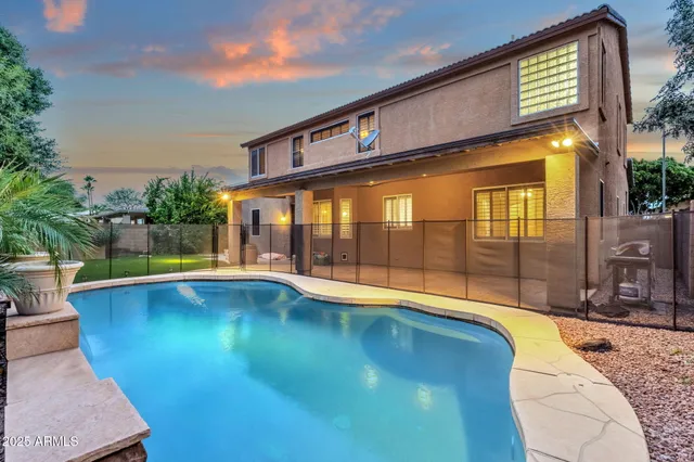 a front view of house with yard and outdoor seating