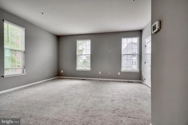 a view of a kitchen with a sink cabinets and a living room