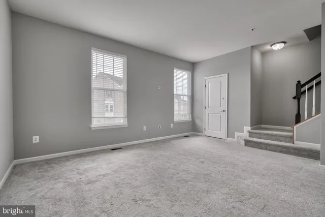 a kitchen with kitchen island a sink appliances and cabinets