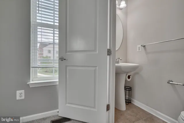 a view of a chair and table on the wooden deck