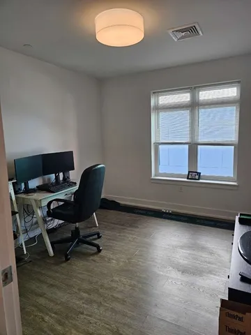 a workspace with furniture and a window