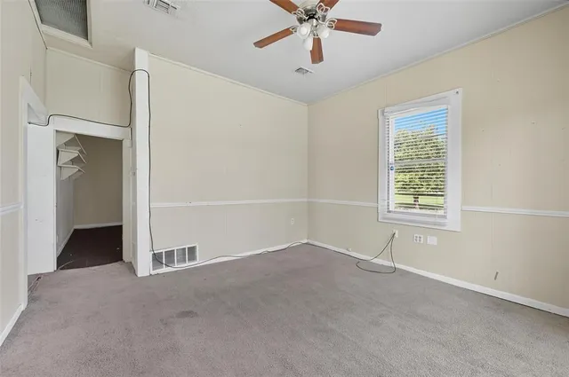 a view of an empty room with a window