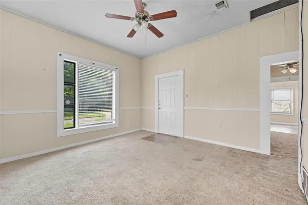 a view of an empty room with a window