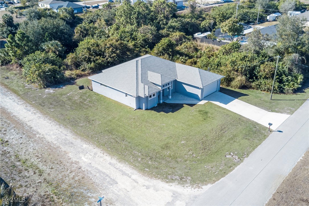 3309 30th Street Southwest Lehigh Acres, FL 33976 - Photo 23 of 28 an aerial view of a house