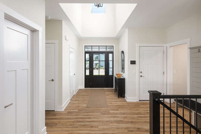 305 Leeward Way Ottawa, IL 61350 - Photo 19 of 53 a view of a hallway with wooden floor and staircase