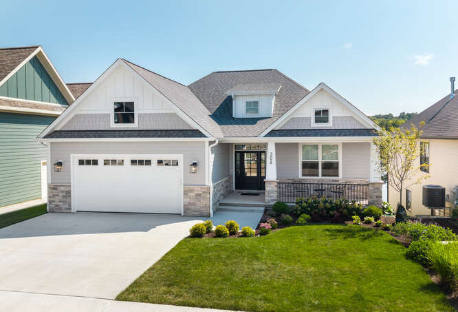 305 Leeward Way Ottawa, IL 61350 - Photo 2 of 53 a front view of a house with a garden and plants