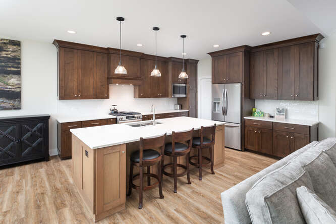 305 Leeward Way Ottawa, IL 61350 - Photo 26 of 53 a kitchen with a sink a stove a refrigerator and wooden cabinets