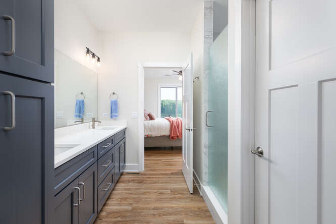 305 Leeward Way Ottawa, IL 61350 - Photo 36 of 53 a en suite bathroom with a sink a mirror and a shower