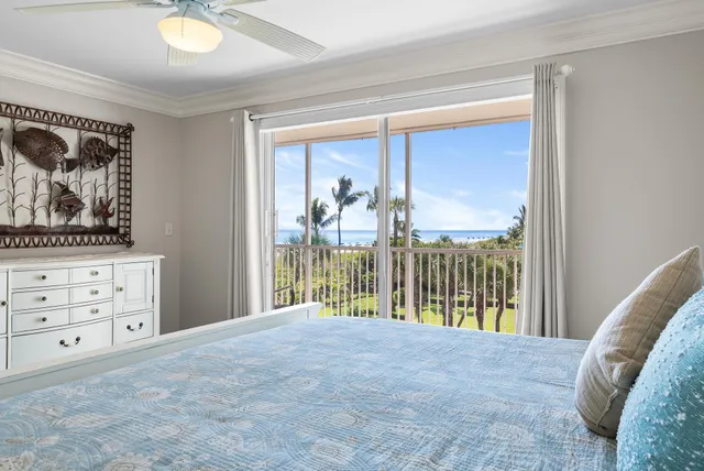 a view of a bedroom with furniture and windows