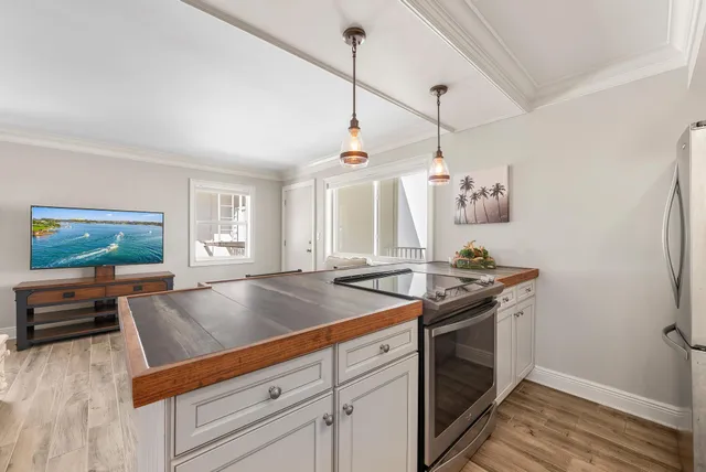 a kitchen with a stove and a sink
