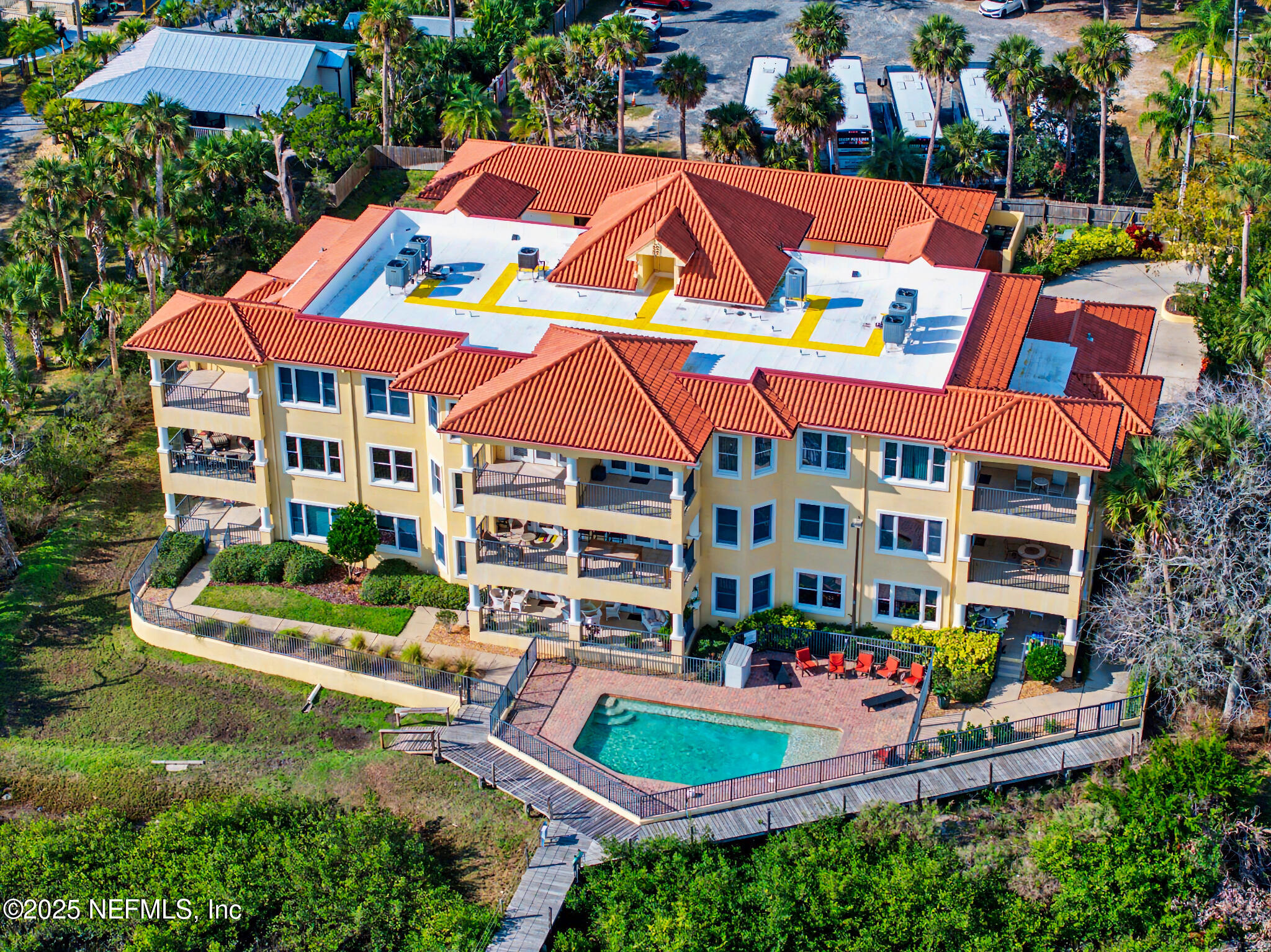 1 Radio Road, Unit 203 St. Augustine, FL 32084 - Photo 47 of 57 a view of swimming pool with a garden and plants