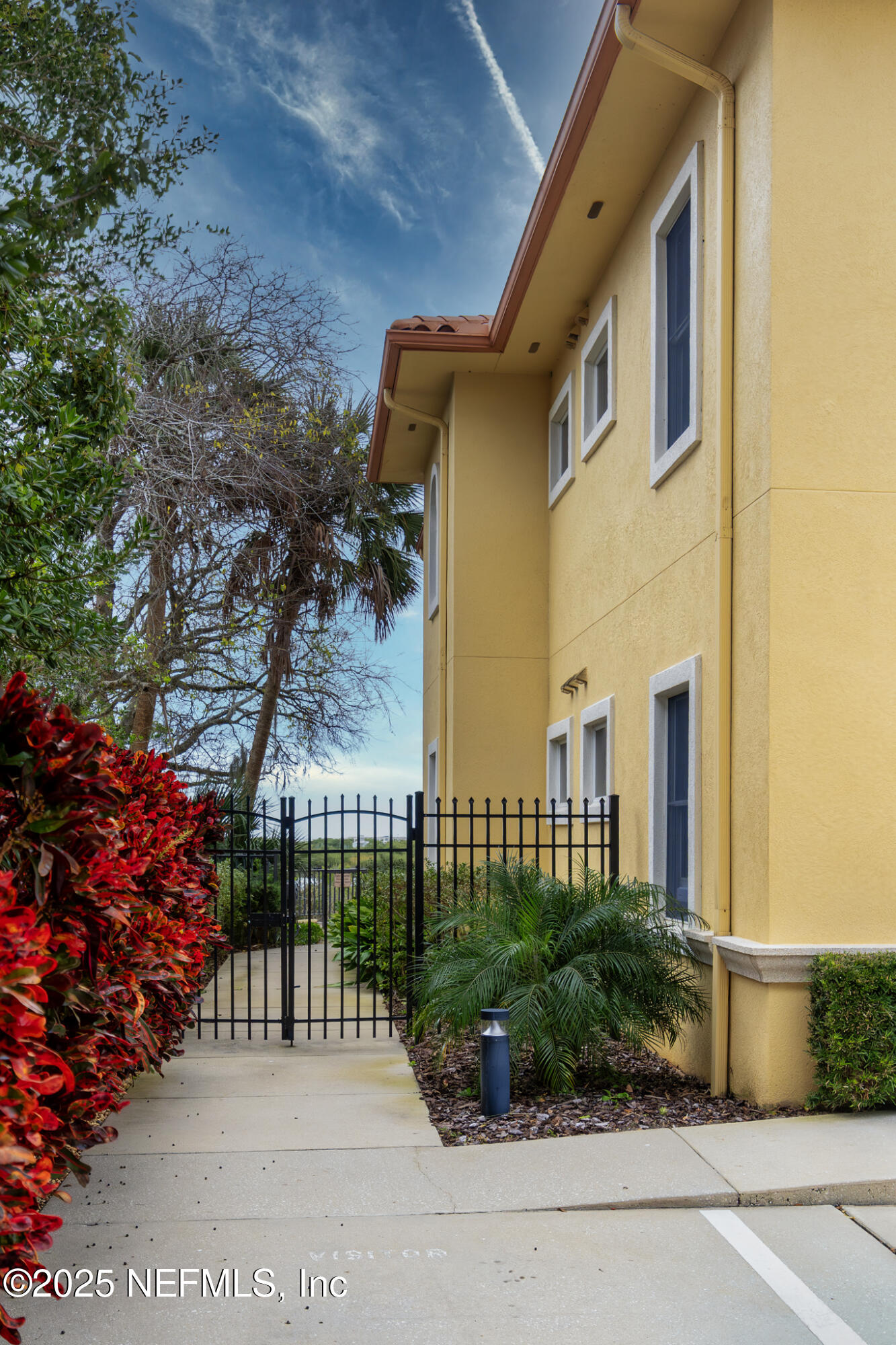 1 Radio Road, Unit 203 St. Augustine, FL 32084 - Photo 49 of 57 a view of a house with a garden