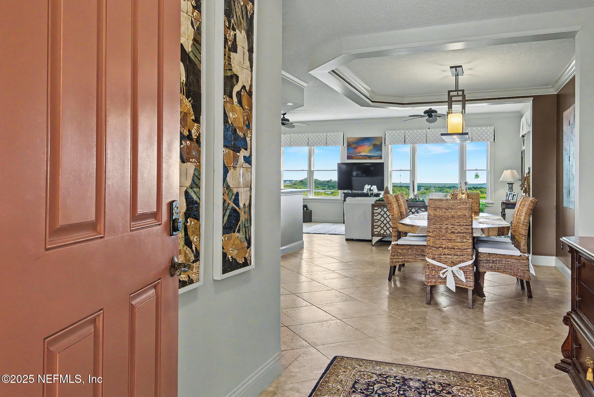 1 Radio Road, Unit 203 St. Augustine, FL 32084 - Photo 5 of 57 a living room with furniture a fireplace and a chandelier