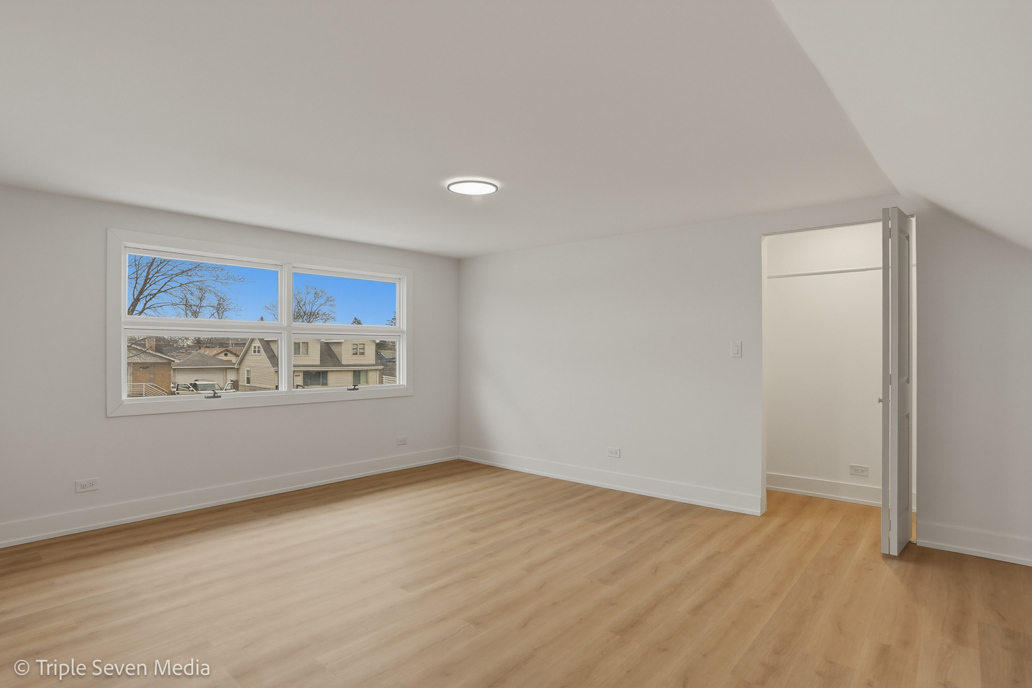 5831 81st Place Burbank, IL 60459 - Photo 22 of 31 a view of a room with wooden floor and window