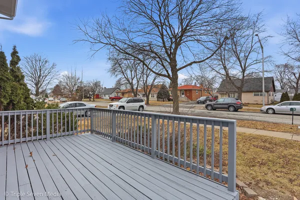 a view of street with wooden deck