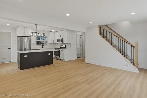 a view of kitchen with wooden floor