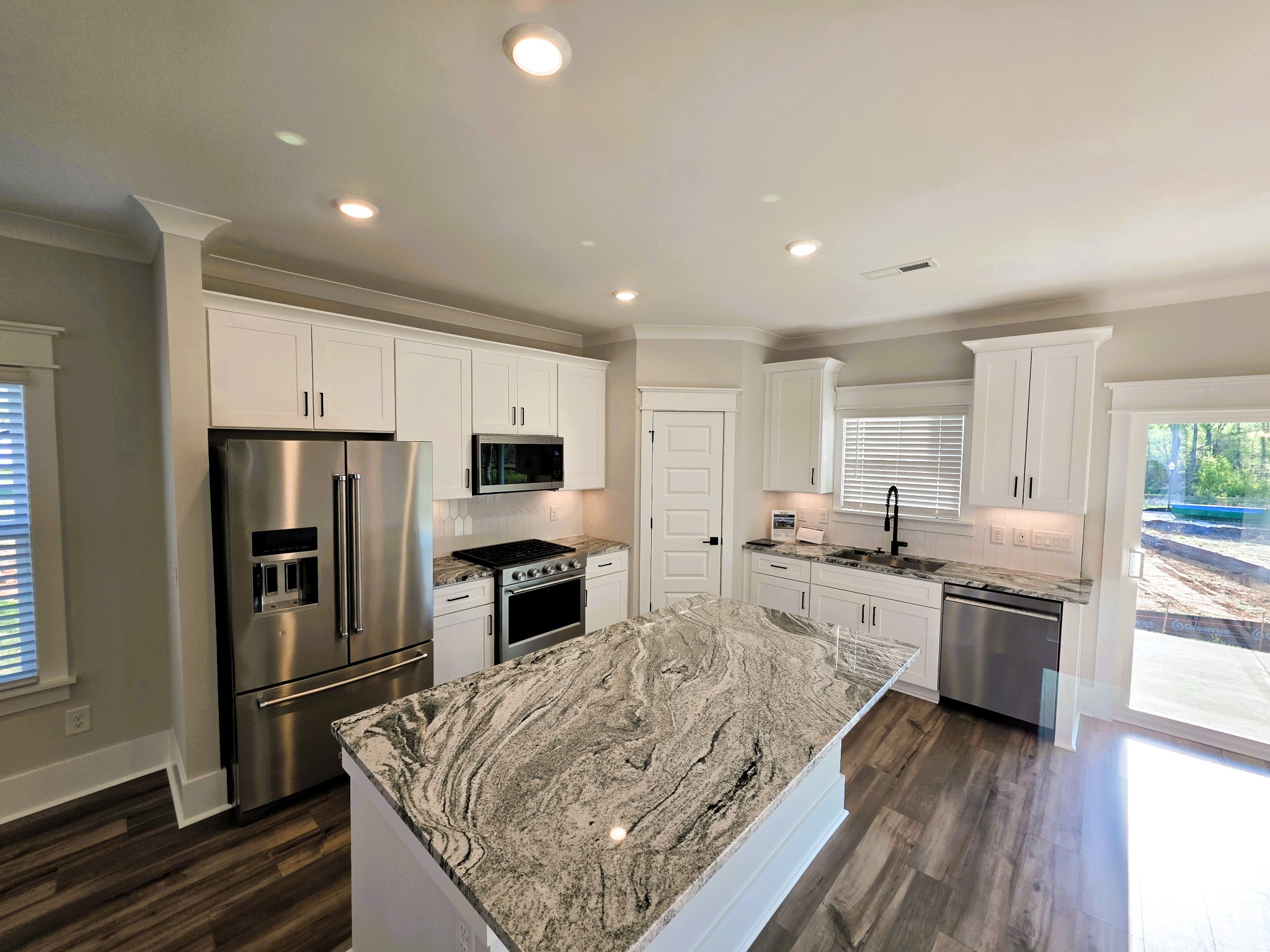 369 Springbrook Boulevard White House, TN 37188 - Photo 8 of 30 a large kitchen with kitchen island a sink stainless steel appliances and cabinets