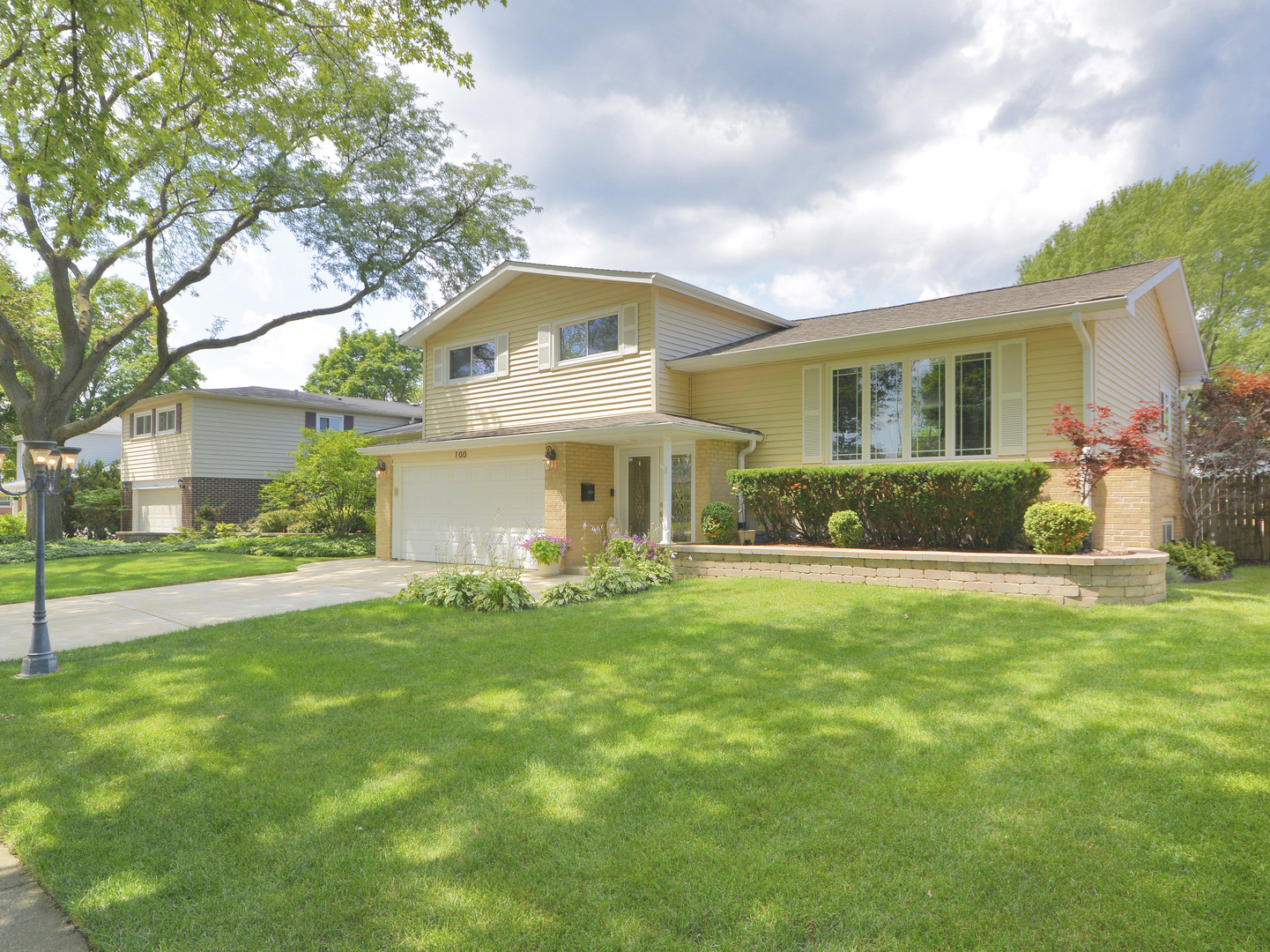100 Ambleside Road Des Plaines, IL 60016 - Photo 1 of 15 a front view of house with yard and green space