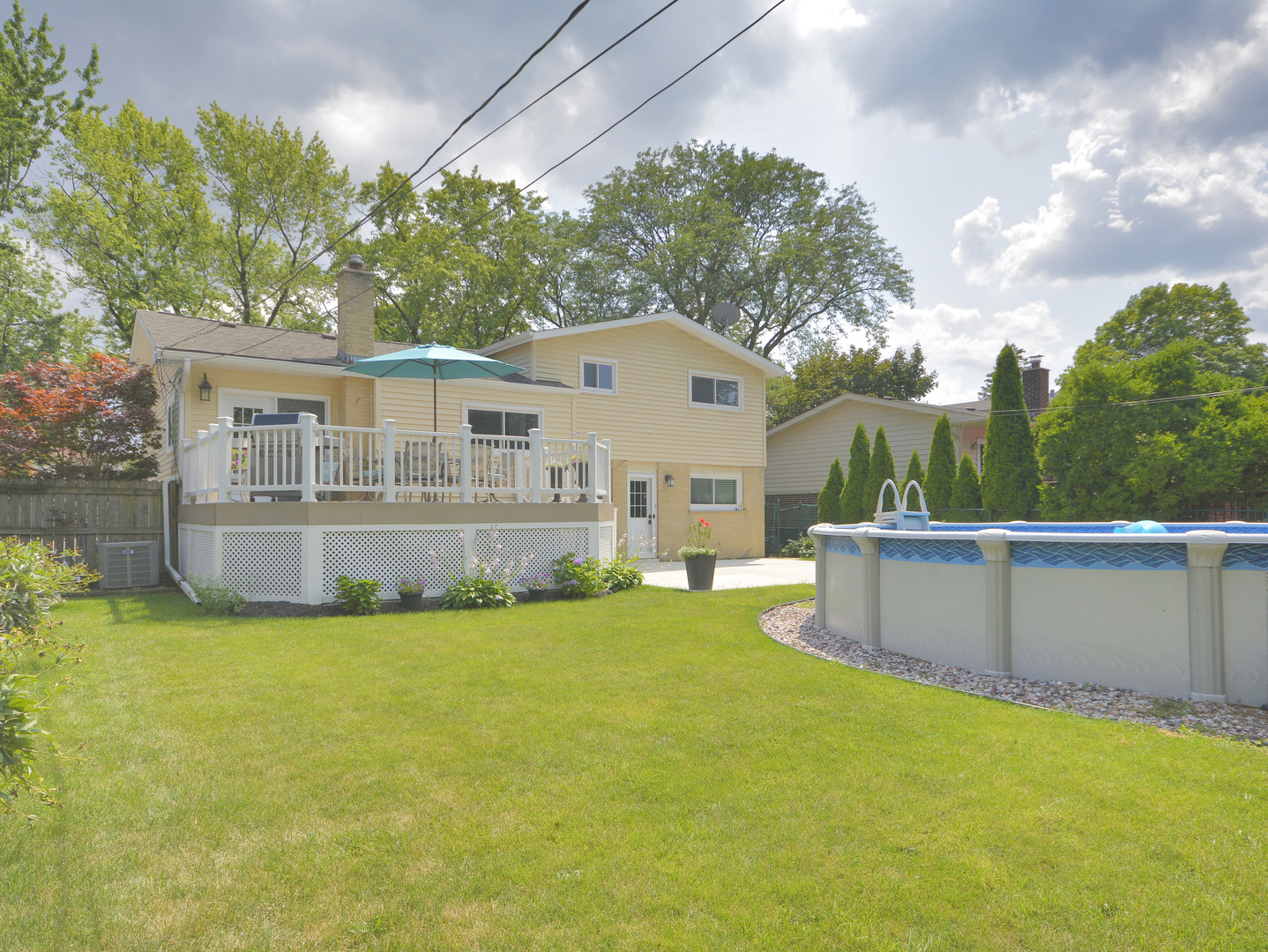 100 Ambleside Road Des Plaines, IL 60016 - Photo 15 of 15 a view of a house with a yard and sitting area