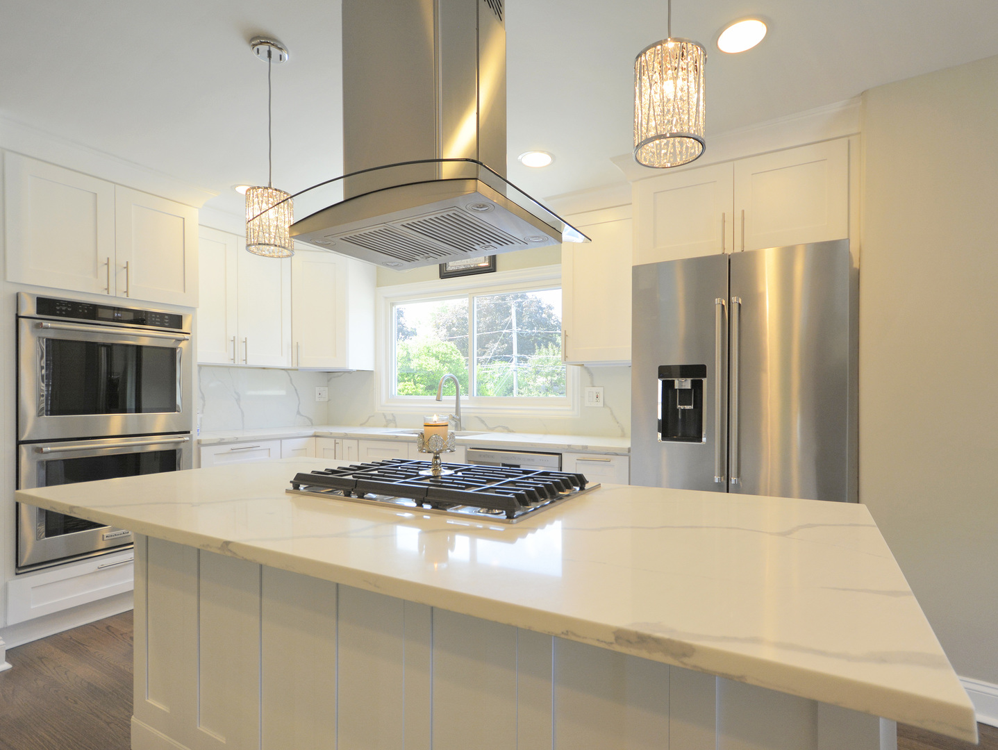 100 Ambleside Road Des Plaines, IL 60016 - Photo 3 of 15 a kitchen with stainless steel appliances a stove a refrigerator and a chandelier