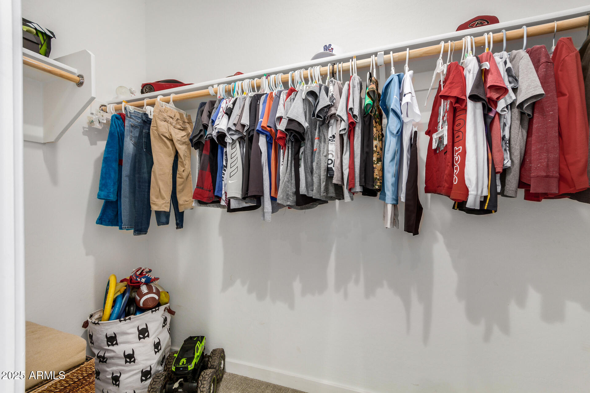 13319 West Red Range Way Peoria, AZ 85383 - Photo 26 of 38 a view of walk in closet with clothes