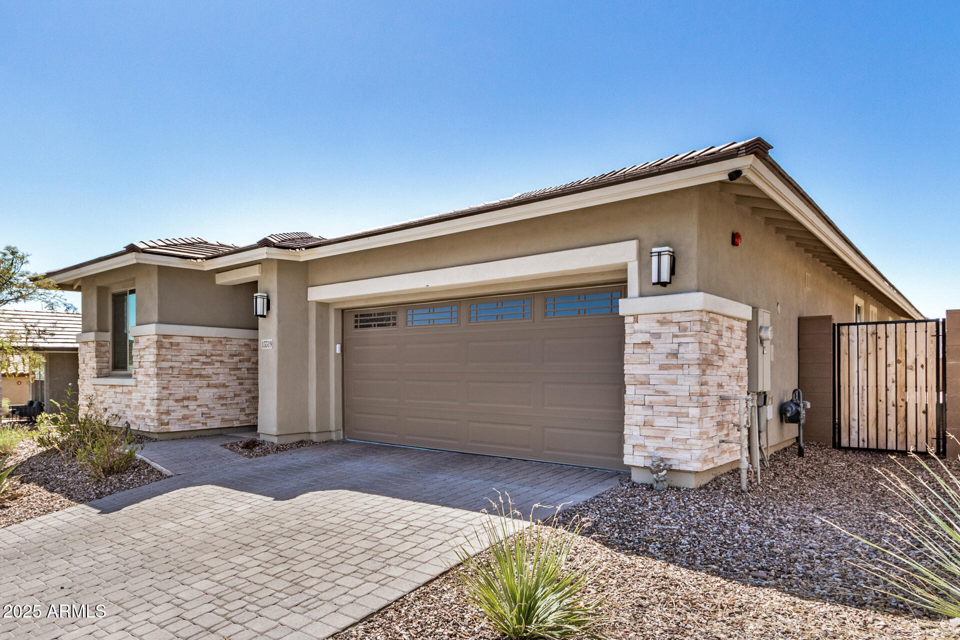 13319 West Red Range Way Peoria, AZ 85383 - Photo 3 of 38 a view of house with garage